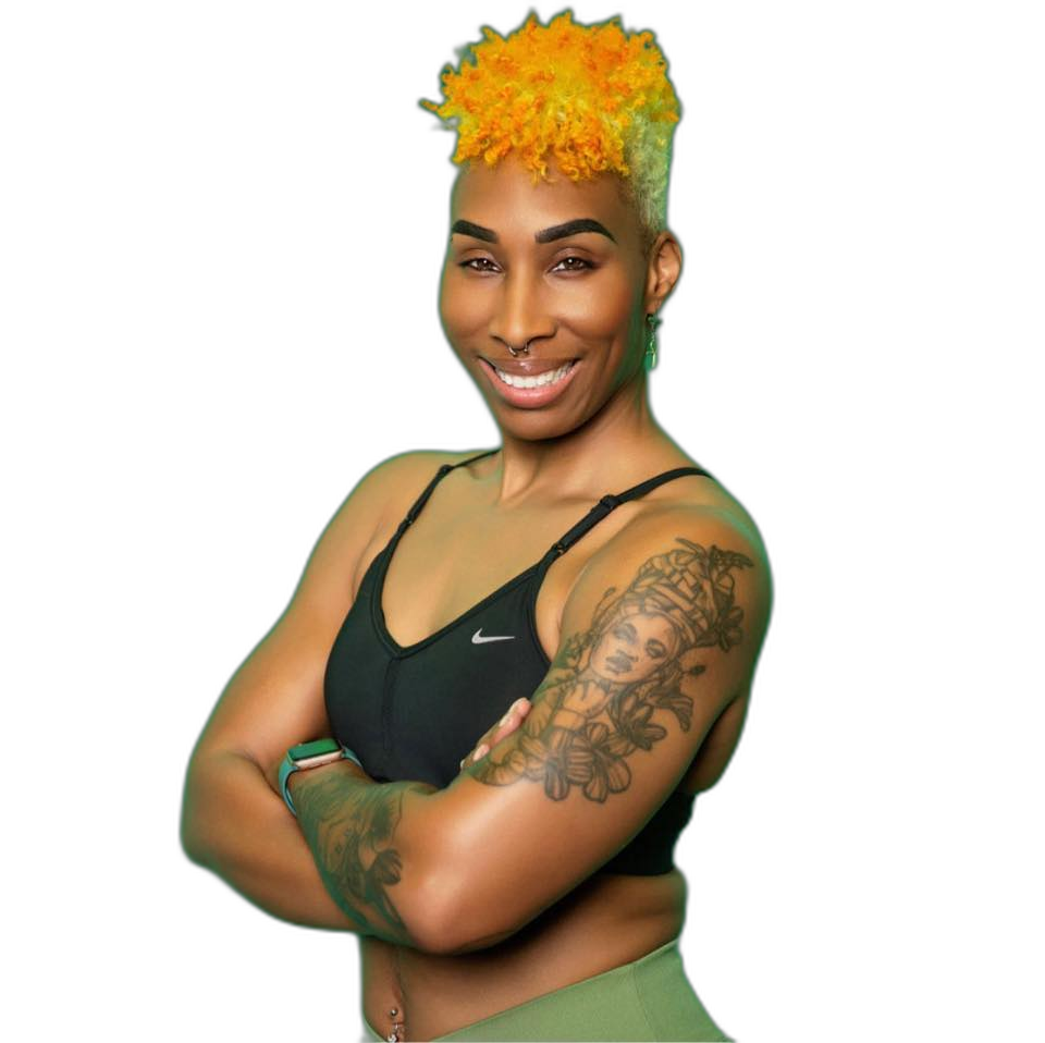 Coach Nika - Trauma-informed strength trainer for women over 35, standing confidently with arms folded