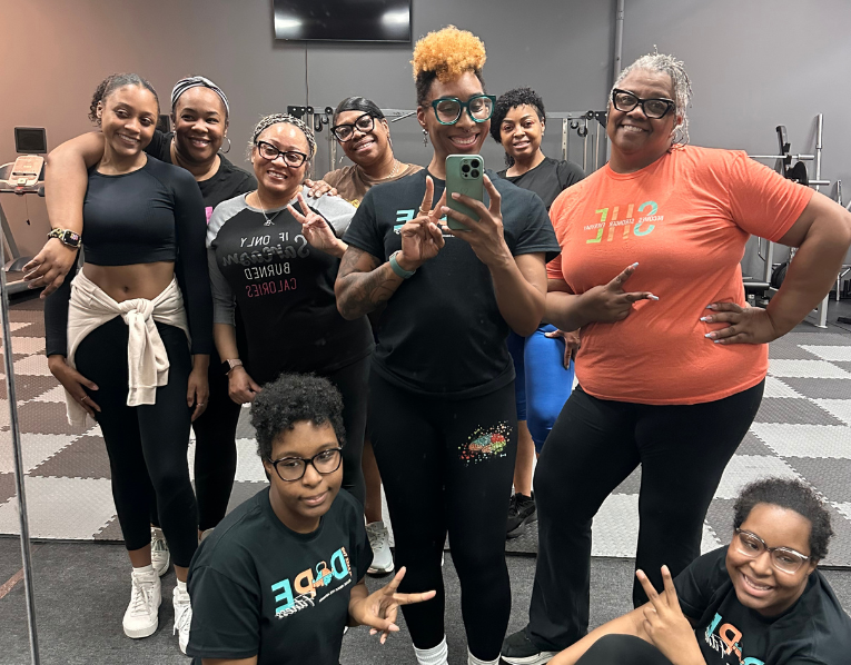 ReleaseHER Fit Club members posing together after a workout